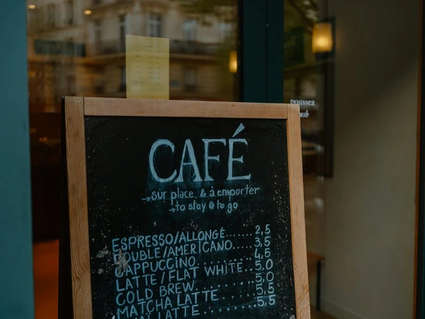 Real cafe chalkboard with the espresso price handwritten as 2,5